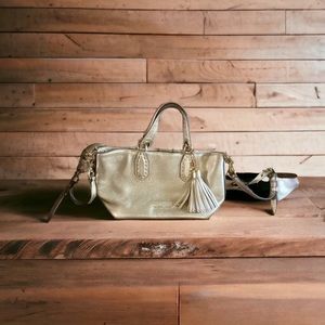 Michael Kors gold purse with fringe tassel.